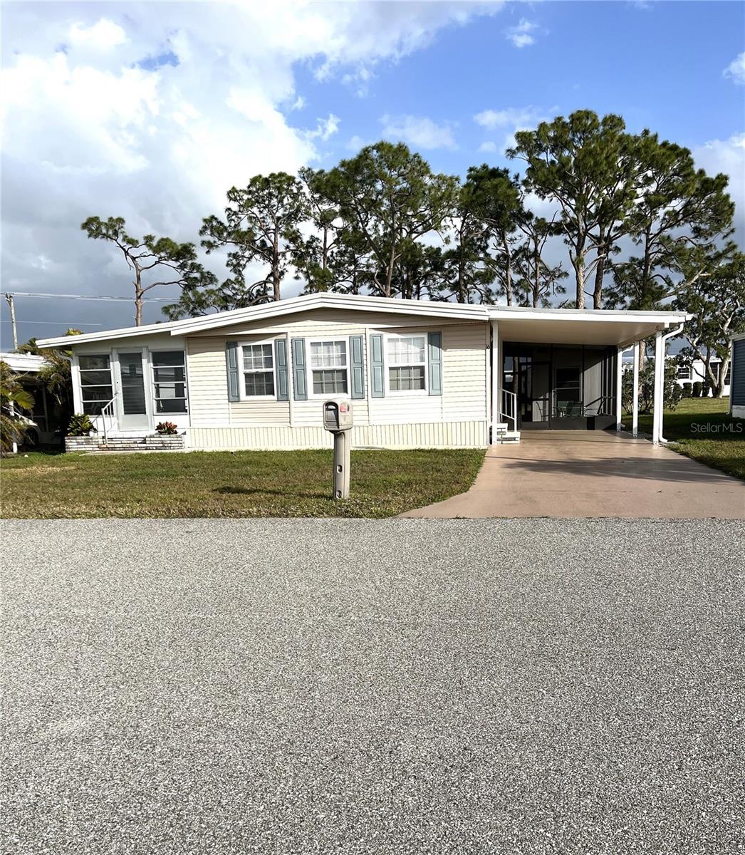 Well maintained home in the desirable retirement community of Harbor Isles. The community is land owned, pet friendly with resort like amenities and a multitude of activities year round. Plenty of outside areas to enjoy the beautiful weather. There is a large rear yard and patio, a screened in lanai and a glass enclosed Florida room. The cook of the household with love the spacious kitchen with newer beadboard cabinets , lots of counter space and tile floor. The dining room has plenty of elbow room and is convenient to the kitchen. The living room is large and includes a cozy TV alcove. Bedroom 2 has a walk-in closet and is steps from the guest bath. The primary en-suite enjoys 2 closets, a dressing area and a private toilet/shower room. Overall, a very comfortable home. The home has been re-sided and all windows/doors have been replaced. The A/C was replaced January, 2025 with a 10 year parts warranty, concrete pad and hurricane tie downs. Carport 2023 and hot water heater 2018. Membrane roof 2019 with a transferrable lifetime warranty. New vapor barrier 2025 and all tie downs passed inspection. Great solid home waiting for a new owner. Close to Atlanta Braves ball field and event center, downtown Wellen Park shopping & dining, beaches, boating, theatre, museums, airports and more! Call today for your personal or virtual tour!