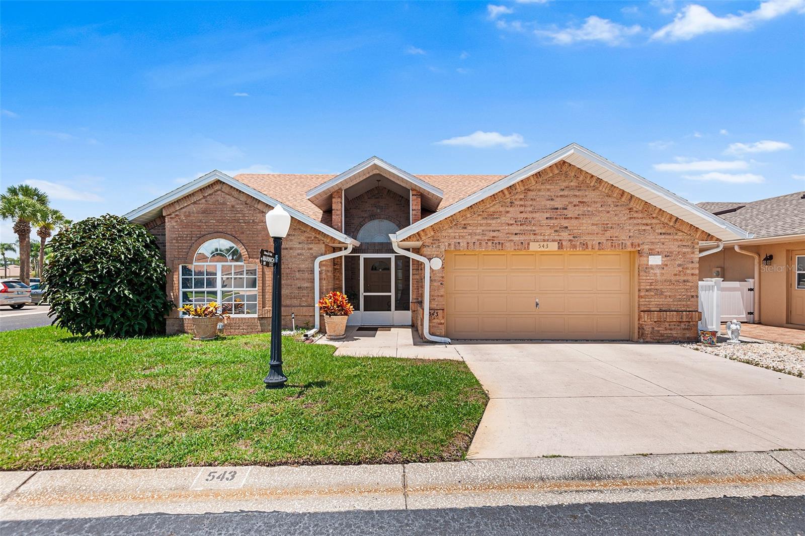 55+ COMMUNITY! CLOSE TO ALL THE AMENITIES! This SPACIOUS and approximately 1868 SF 2BR/2BA home with bonus room and Florida Room is located on a corner lot directly across the street from the clubhouse in the HIDDEN JEWEL, Lake Henry Estates, an Active 55+ Gated and Resident Owned Community! The attractive exterior features brick stucco facade, architectural roof installed summer 2023 and a screened front entry. As you enter the foyer, the bonus room, bedroom #2 and guest bath are to the left and a large coat closet is to the immediate right. Straight ahead is the living room with vaulted ceiling, with the Florida room beyond. The dining room is adjacent to the attractive kitchen featuring breakfast bar, wood cabinetry, granite countertops and tile backsplash. A pantry closet and laundry room are located just around the corner. The primary bedroom has a walk-in closet and an ensuite bathroom with tub and a separate shower. The bonus room could be easily used as a third bedroom, if desired. The following updates have been completed: AC/heat system replaced 2024; refrigerator, dishwasher, garbage disposal and washer replaced 2019; 6 dual pane windows installed 2014-2015. This house was originally a builders model home with the base heat area by public record at 2064 SF which includes the garage. The owners have the garage vents closed. Heated and cooled area is estimated at 1868 SF. The seller will assign the buyer one voting share in the Sweetwater East Investment Co. after closing. 2024 taxes INCLUDE $618 non ad-valorem assessment for Polk County waste collection/disposal & fire services. The monthly maintenance fee includes 8000 gallons water, sewer, internet, cable TV, and use/care most amenities. Community amenities include: 12,000 SF clubhouse w/library, pub, ballroom, gym and billiards room; 9 hole executive golf course; heated pool & spa; horseshoes, tennis, pickle ball & shuffleboard courts; wood working shop; RV storage; & boat dockage. Conveniently located close to shopping, restaurants, churches, medical clinics and hospitals. Easy access to I-4 and HWY 27! Enjoy day trips to area attractions, Tampa, Orlando and beaches on the east or west coast! 55+ COMMUNITY. MAY HAVE 2 PETS UP TO 20# EACH. $300 ONE TIME NEW RESIDENT FEE. Information is believed to be accurate but not guaranteed. All sizes, square footages and measurements are approximate.
