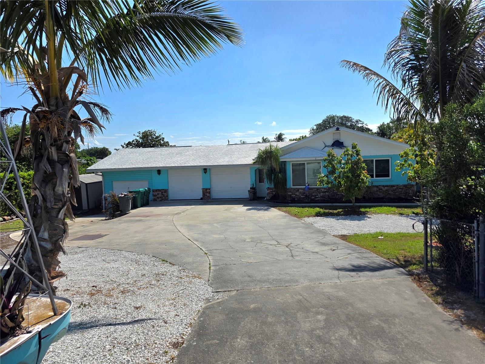 ~Treasure Island~ Waterfront Paradise with Concrete Fortress Charm
This well-maintained waterfront gem offers the perfect Florida lifestyle with two bedrooms and two bathrooms. Solidly built with concrete block walls filled with concrete for ultimate durability, this home features hurricane windows and a recently sealed roof, providing peace of mind during storm season.
Step outside to your personal oasis featuring a seawall (replaced in 2021), boat house with working lift, and fish cleaning station—perfect for the avid angler! Enjoy the 20-foot screened porch, salt water above-ground pool, and bar/spa room for entertaining or unwinding after a day on the water.
Recent upgrades include a maintained air conditioning system with a new fan, attic insulation with a solar exhaust fan, and fresh paint inside and out. The property boasts a tropical fruit garden with banana, star fruit, avocado, mango, papaya, and peach trees.
Equipped with a two-car garage plus bonus workshop space for all your storage needs.
All measurments are approximate.