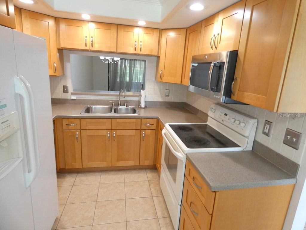 Photo of 2211 Eisenhower Drive #106, Dunedin, FL 34698 (MLS # W7883939)