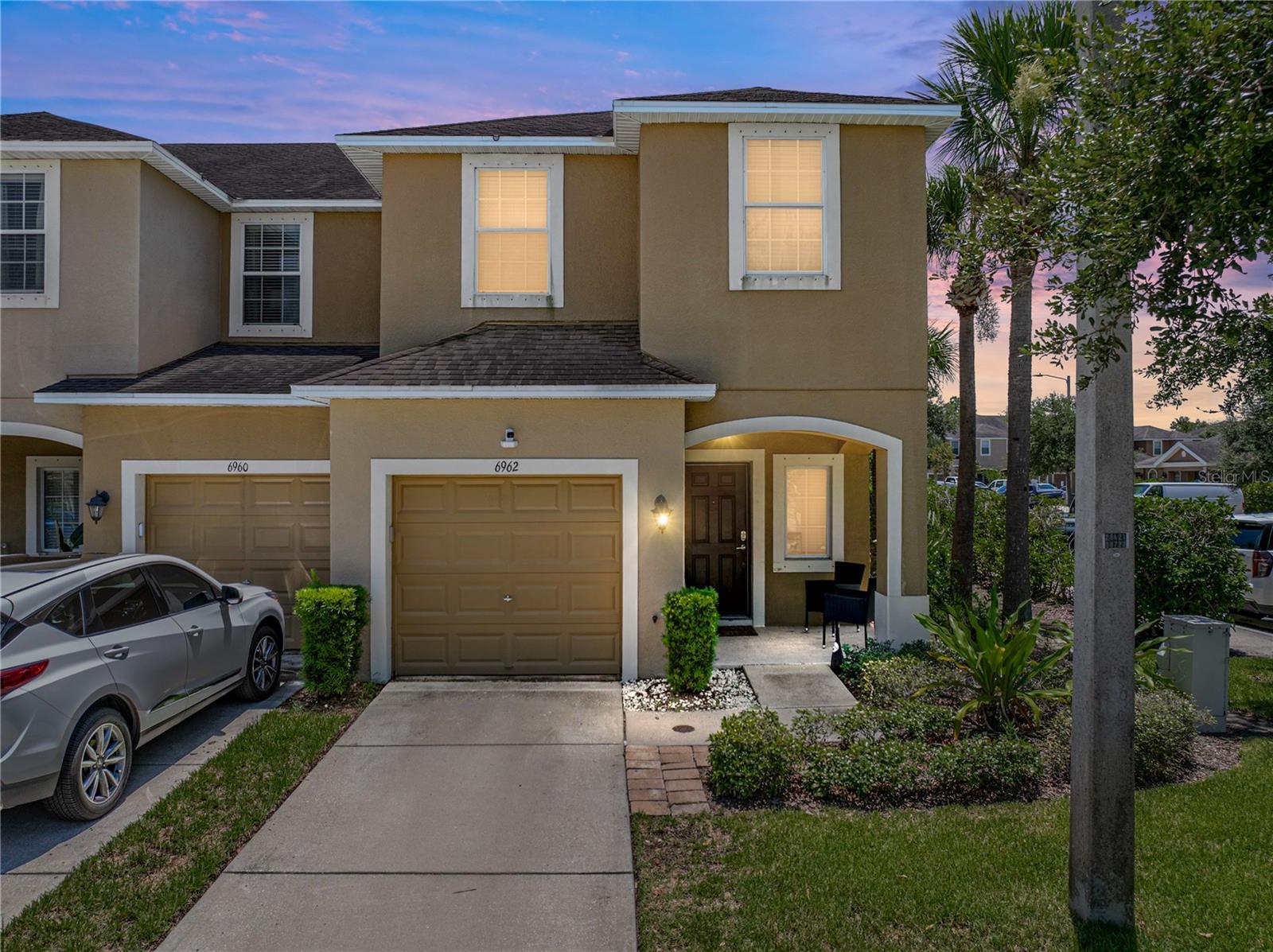 Don't miss this opportunity to own this stunning corner lot townhome!! Entering you will find the open Kitchen and Living room combo situated towards the back of the home. You will be able to start envisioning friends and family gatherings for all those weekend game nights or holidays. There is a half Bathroom for guest conveniently located downstairs. Yes it is true this townhome does have a one car garage!! As you make your way upstairs there is a landing area greeting you. The Primary Bedroom is located at the back of the home upstairs with a generous size walk in closet. The back lanai is screened in, perfect for relaxing evenings or your early morning coffee. Contact me to view this beautiful home.