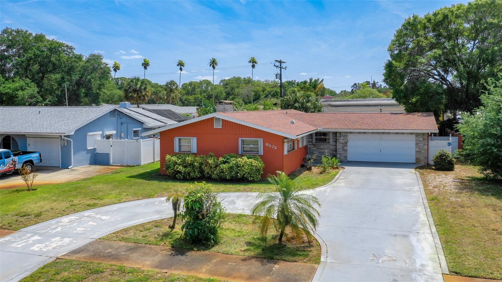 PRICE ADJUSTMENT to this Beautiful 3 bedroom, 2 bath home in one of St Pete's most exclusive neighborhoods, Eagle Crest! Open floor plan with a large bonus room. House has terrazzo floors throughout with bedrooms carpeted for comfort. Large 2 car garage for all your toys. House offers many options to make the space your own. Big lot with a nice outdoor space for all your entertaining. Extra cabinet space in the Kitchen. House is close to shopping, schools, restaurants. Minutes to beaches and close to downtown Saint Petersburg. Easy access to Interstate 275 and airports. Blocks from the Pinellas County trail. Home is in a no flood insurance required zone. Heat/Air updated 2021, Roof with architectural style shingles 2016, Electric updated 2021, Across the street from park. Shed conveys. Come see this home today and don't pass up the opportunity to live in historic Eagle Crest!!!