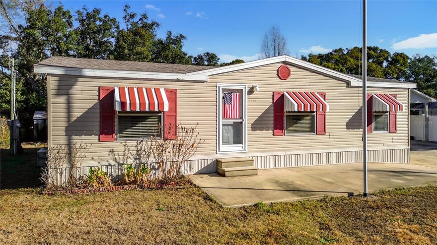 Exceptionally maintained and thoughtfully improved, this double-wide manufactured home delivers a rare combination of functionality, space, and pride of ownership. The property features a true 4-car tandem garage—appearing as a standard 2-car from the front but offering extended depth ideal for vehicles, storage, or workshop use. Inside, the home presents clean, well-kept living spaces with a comfortable layout, a dedicated laundry room, and a fully enclosed screened-in patio that expands your usable living area year-round. The oversized driveway provides outstanding parking capacity, and the lot itself offers unique potential for future use or customization. If you’re seeking a move-in-ready home with strong utility, quiet surroundings, and room to grow, this property stands out in the Silver Springs market.