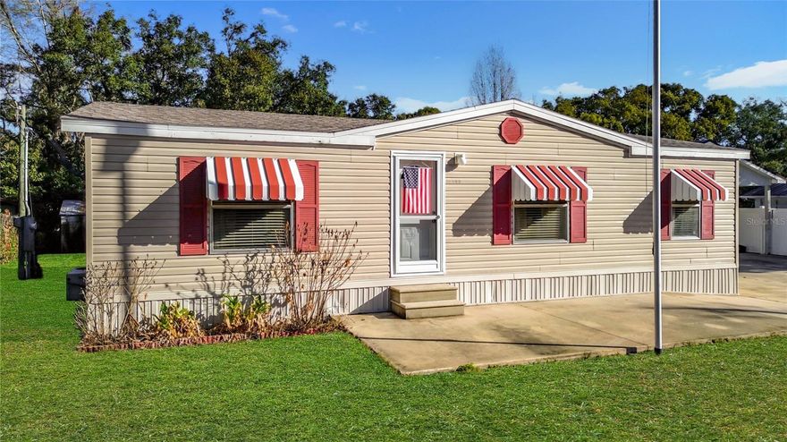Exceptionally maintained and thoughtfully improved, this double-wide manufactured home delivers a rare combination of functionality, space, and pride of ownership. The property features a true 4-car tandem garage—appearing as a standard 2-car from the front but offering extended depth ideal for vehicles, storage, or workshop use. The home’s roof was replaced in 2022, and the detached garage received a new roof in 2025, adding valuable peace of mind for future owners. Inside, the home presents clean, well-kept living spaces with a comfortable layout, a dedicated laundry room, and a fully enclosed screened-in patio that expands your usable living area year-round. The oversized driveway provides outstanding parking capacity, and the lot itself offers unique potential for future use or customization. If you’re seeking a move-in-ready home with strong utility, quiet surroundings, and room to grow, this property stands out in the Silver Springs market.