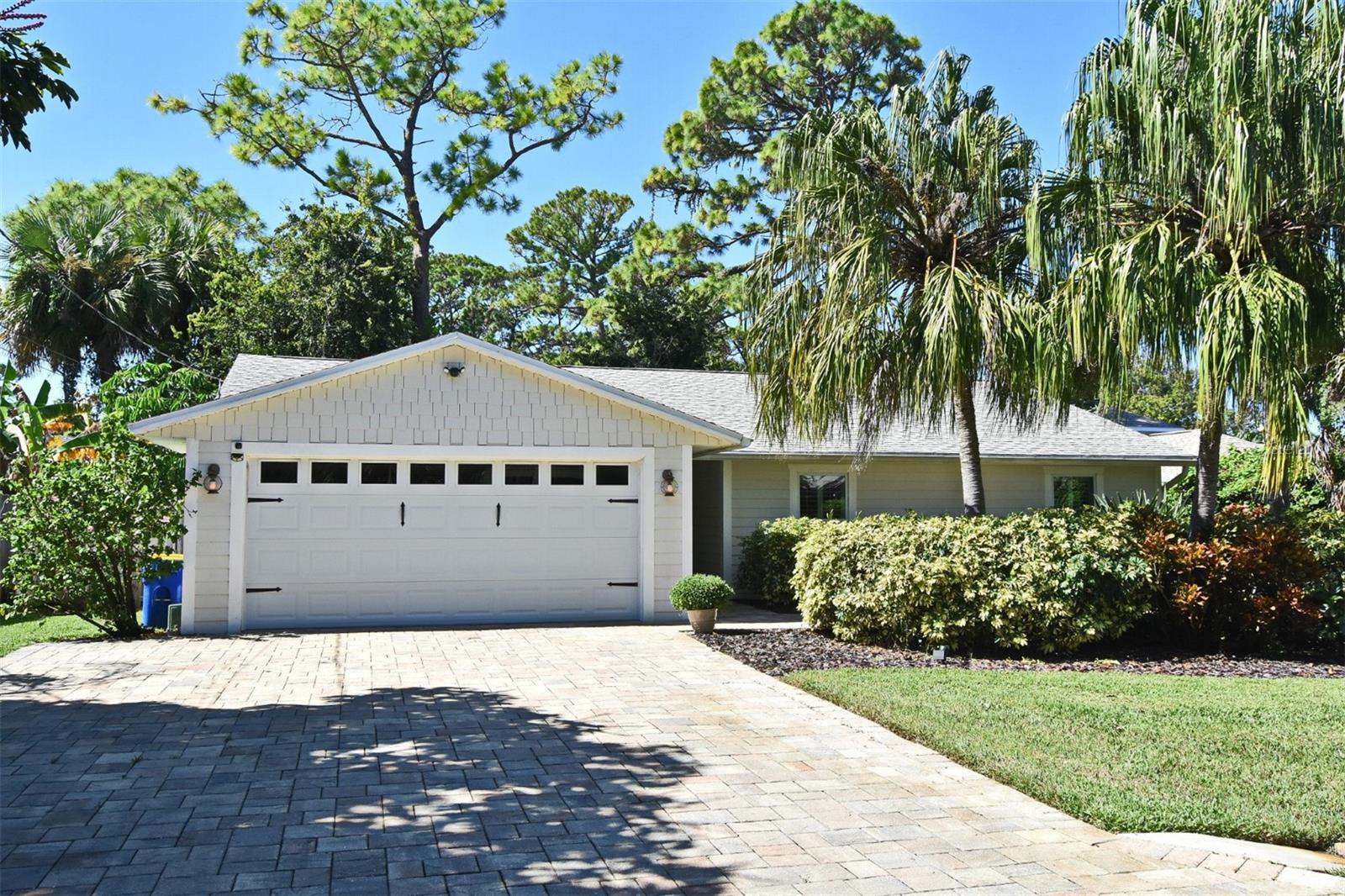 Incredible opportunity to live near the Intracoastal Waterway on a quiet cul-de-sac Edgewater, FL. Beautiful 3 bedroom, 2 bath, open plan home, featuring 1612 SF. Bahama window shutters, and custom window treatments. Open kitchen with well-appointed appliances, quartz countertops, and large pantry. Bathrooms have updated, tile & fixtures. This home is perfect for entertaining and loaded with storage features. AC 2016, Tankless WH 2022.                                                                                                                                                                                                                                                                                                                                                                                                                                                                                          Private secluded backyard is fenced with large screened porch and paver patio. North side of home has space for boat parking! Well sized 2- car garage. Separate laundry room with hobby area. Easy short walk to Riverfront Park for walking, biking & picnics, exercise and playground. Public Boat Ramp, for fishing, boating!  Exceptional value so close to the waterway!