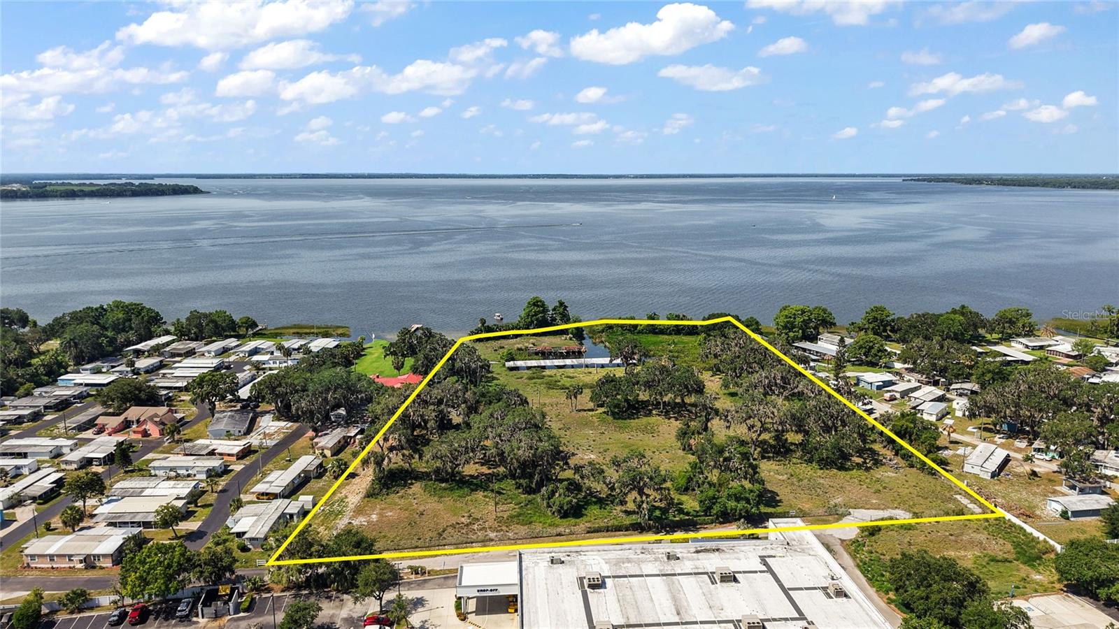 Offering is for 6.93+/- Acres directly on Lake Harris with over 400+/- ft of lake front. Site is zoned CP, Lake County and less than one block off US Hwy 441 and under an hour to Orlando or The Villages. Development potential includes Multi-Family, Hotel w/ Marina and other potential uses. The popular and beautiful Harris Chain of Lakes in Lake County, Florida, is a chain of seven lakes that total approximately 76,000+/- acres of water. The lakes are connected by canals and include Lake Harris and Little Harris, Dora, Carlton, Beauclair, Eustis and Griffin. This opportunity has the potential for many uses. All information is believed accurate and correct but not guaranteed or warranted and subject to change without notice.