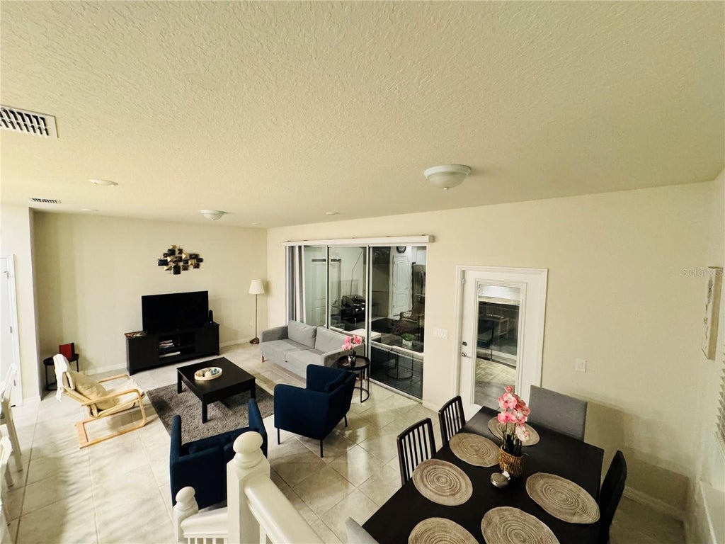 Photo of 7479 Oakmoss Loop, Davenport, FL 33837 (MLS # S5158616)
