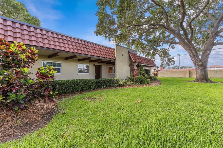 Turn-key 2 BR 2 BA condo in 55+ one-story villa community, exempt from the recent legislation mandating expensive structural inspections and assessments for multi-story condominiums. No Flood Zone and no flooding from recent hurricanes. Fully furnished. Just bring your swimsuit and toothbrush. New roof, HWH and PGT Hurricane Windows. New windows make the condo sound proof, so no noise from nearby high school. HVAC comes with 1 yr service contract. Additional Full Home Warranty through August 2026. Minutes by car, golf cart or bike to Dunedin’s beautiful beaches, vibrant downtown and the Pinellas Trail. Walk to the nearby Dunedin Community Center to use the gym, attend a yoga class or visit the library branch. Attend art or cooking classes next door at the Dunedin Fine Art Center. Amenities include heated pool, clubhouse, shuffleboard courts, social events and picnic area with grills. The grounds are lush and green with cool shade from ancient oaks and tropical landscaping. Deeded carport with guest parking. Natural light fills the condo due to fresh white paint, new PGT hurricane rated windows and new vinyl blinds. Wood-look ceramic tile in every room. Open floor plan living/dining area can be configured in many ways, depending on your desired lifestyle. Updated kitchen has new stainless appliances, double sink, disposal, white cabinets and faux stone countertops. Everything you need to cook and entertain is provided. Even a fun bar cabinet. Primary bedroom boasts two large closets and an updated ensuite bath with walk-in shower. Guest room has a walk-in closet that doubles as a utility room with storage for large items. Updated Guest bath, with linen closet, has a deep tub with shower, fresh tile, cabinet and designer mirror. Monthly fee of $670 includes building maintenance and insurance, water, sewer, trash, cable & internet. One cat or service animal allowed. No short-term leasing of units. This condo offers the perfect combination of modern conveniences, community amenities, and an ideal location to enjoy the best of Florida.