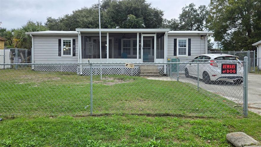 Larger, double wide manufacture home which you own the land with 1104 sq. ft of interior living area total 1400+ sq. ft with interior laundry room and large workshop. The kitchen has previously been updated and is equipped with plenty of cabinets and counters, space for cooking and entertaining. Three (3) bedrooms, two (2) baths, inside laundry area, and extra bonus utility room that could be used as a workshop. Newer roof and windows, a shed and hard top carport. Updated bathrooms and flooring along with totally fenced in yard !  Very cute, open floor plan with plenty of space.  No HOA!!