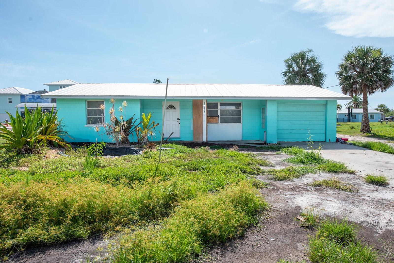 This exceptional waterfront property in Englewood, Florida, offers a rare opportunity to design your ultimate coastal lifestyle. Imagine exploring Lemon Bay and nearby pristine beaches with no fixed bridges to hinder your adventures. While the existing home was recently impacted by hurricanes, this setback presents an incredible advantage: a blank canvas for your vision. You have the flexibility to either renovate and reimagine the current structure or design and build an elevated, flood-resilient home perfectly tailored to your desires. Enjoy the serene canal views and the peaceful ambiance of waterfront living, complete with a concrete seawall, dock and boat lift. This prime location provides unparalleled access to world-class fishing, stunning beaches, and a variety of vibrant waterfront dining options. Conveniently situated off Placida Road, you're just minutes from Don Pedro State Park, the renowned Boca Grande beaches, incredible local restaurants, the post office, banks, and grocery stores. This is a chance to secure a well-positioned waterfront parcel and craft the coastal retreat you've always envisioned. Don't let this unique opportunity pass you by – schedule your viewing today and begin to imagine the possibilities!