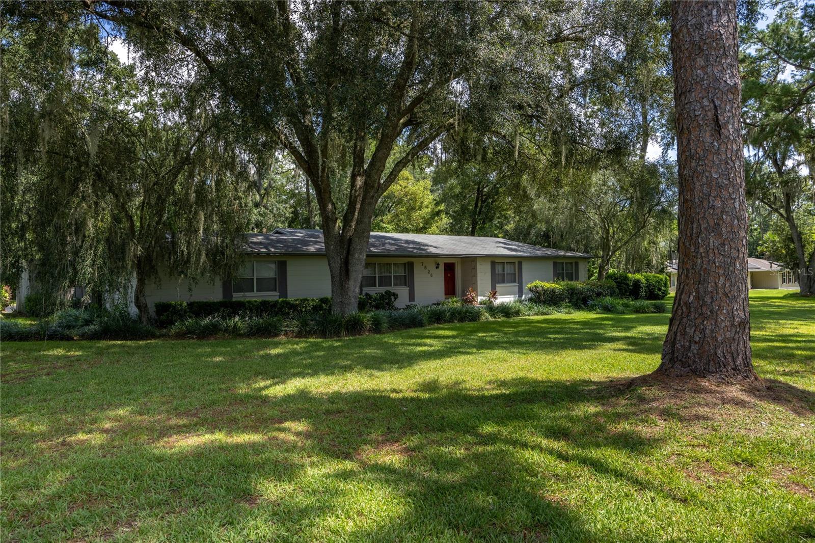 Priced to sell and ready for your personal touch, this CBS home is nestled on just over an acre of beautifully landscaped land. Offering 3 bedrooms, 2 baths, and a dedicated office, it is full of potential. Inside, you’ll find the charm of a formal living and dining room, along with a welcoming family room featuring a freestanding fireplace—perfect for gatherings and cozy evenings. Step outside to the screened patio overlooking a tranquil water feature, an ideal spot to relax and unwind. The expansive yard provides plenty of space to enjoy the outdoors and includes a large detached storage shed, perfect for lawn equipment or hobbies. With its solid construction, versatile layout, and serene setting, this home is ready for you to make it your own. Updates include roof (2013), AC (2016), water heater (2021), and whole-house repipe (2021).