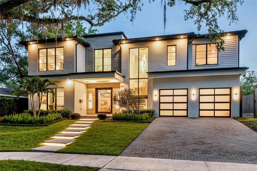 BEVERLY SHORES/ROSE ISLE WELCOMES THE NEWEST ADDITION TO THE ORLANDO/WINTER PARK LUXURY NEW CONSTRUCTION HOME MARKET!  BUILT BY RARE BUILDERS! A BUILDER THAT SET THE BAR FOR INTRIGUING LUXURY CUSTOM HOMES AND CONTINUES TO RAISE IT! This latest home is a shining example and has come together perfectly as a unique, awe-inspiring estate offering an unparalleled combination of exceptional function, modern aesthetics and elegance. Prominently sited on a large elevated lot... an eye catching show piece with a dramatic front elevation and grand stylish presence boasting 4600 sq ft of living space (almost 3000 on the ground for alone).. .  Floor plan features a large private ground floor primary suite, second large ground floor guest suite, and an additional second floor
primary suite option. Please see floor plans in photos and CLICK ON TOUR LINK FOR A COMPREHENSIVE VIDEO WALK THROUGH TOUR.
This rare ground floor design offers space and a configuration that you just can't find in the current market: Multiple suites, a dramatic entrance with floating staircase , expansive main kitchen/dining/living area that integrates perfectly with the resort-style outdoor/pool/spa area, fire & water features, two fireplaces, an incredibly well appointed kitchen + walk-in butler's pantry and additional front study. Entire home is adorn with absolutely beautiful finishes and design features from the extensive use of glass to the sophisticated and warm wood ceilings, gorgeous stone and exceptionally well curated final fixtures and finishes features that have to be seen in person to truly appreciate the feel and impact made by profession design planning at this level throughout the entire home. Second floor offers a large loft with high and bright exposure, the second primary suite option, two additional large bedrooms and two more full baths.... 6 baths total! You will not find a better opportunity to secure a highly detailed, unique, luxury home in the Orlando/Winter Park area that offers the feel, presentation and function of 1211 Munster. Located in a fantastic  location in the highly desirable Audubon Park School K-8 School District. Minutes to DT,Orlando, DT Winter Park, WP Park Ave. Shopping, Winter Park Village, Advent Health, ORMC and more. An exquisite Luxury Estate in one of Central Florida's most dynamic areas and desirable areas!