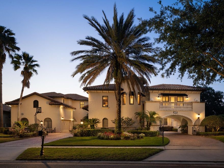 Located in the guard gated community of Reserve at Belmere along the shores of Lake Whitney, this stunning custom home offers 7,300 square feet of living space and is sited on one of the largest lots in the community. With 5 bedrooms and 6/1 bathrooms, this lakefront gem with a private boat dock and lush landscaping ensures the utmost comforts of lakefront luxury living. As you enter the home with beautiful rich flooring throughout, your eyes are immediately drawn to the unobstructed views of sparkling Lake Whitney just outside the large windows surrounding the space. The rooms sweeping custom beamed ceilings are an architectural delight. The spacious, open dining room also provides clear, lakefront views and is ideal for sunset meals. The gourmet kitchen with separate eating area is a chefs dream and is equipped with top-of-the-line appliances, a beautiful center island with marble top, gorgeous custom backsplash, and tons of storage. You will love the convenience of the nearby wet bar and wine cellar. The open-space design allows for uninterrupted flow that leads into the large living room with fireplace, stunning beamed ceilings, and large sliding glass doors to the lanai. Outside, the true stars of this incredible home shine! From the infinity pool with spa offering stunning lake views, to the gas firepit designed for comfortable evenings outdoors, to the TV with fireplace below, to a summer kitchen with DCS grill, this entire space is an entertainers dream with tons of room to host large parties comfortably. The large private boat dock offers the convenience to store your boat and jet skis in a safe space with easy access to jump in and enjoy a day of fun in the sun on the water. The spacious first floor Master suite boasts breathtaking, direct views of Lake Whitney and ample seating area for morning views of the lake. A spa-like master bathroom is a relaxation oasis with a large soaking tub and roomy shower with multiple jets for the ultimate unwind. The space also features separate water closets and a dressing area with multi-directional mirrors. Upstairs, the additional bedrooms are all generous in size and have private baths and walk-in closets. A workspace/loft area upstairs provides space for two with built-ins offering ample storage. An impressive theatre with stadium seating is ideal for screening movies with family and friends. Another highlight of the home is the fully equipped detached guesthouse. Designed with the comfort of your guests in mind, the space offers a full kitchen with all appliances, ample counter space, a private bathroom and private garage. Located in one of the most coveted areas in Central Florida, this home is conveniently located near the areas top dining, entertainment, shopping, and schools. No detail has been overlooked in creating this truly phenomenal Windermere home. Contact us today with any questions and to schedule your tour!