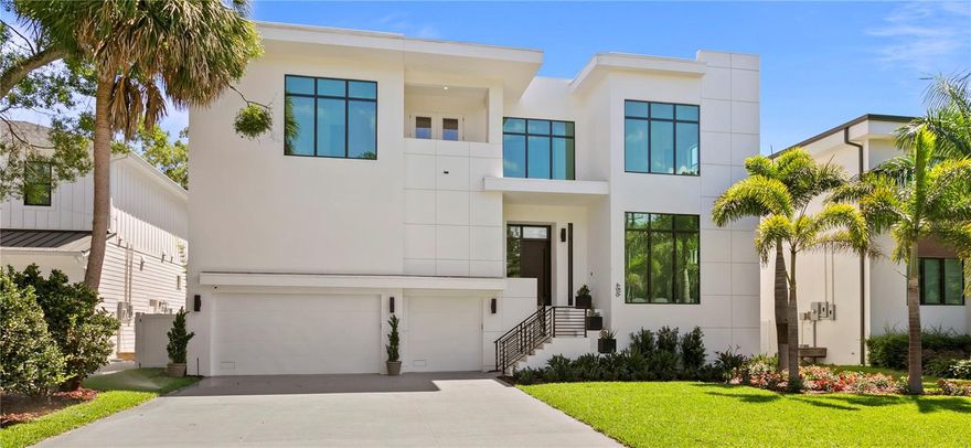 This contemporary pool home by the coveted Adobe Homes features custom details unlike any other home on the market. Spacious open floor plan with 12' Ceilings on first floor and 10' Ceilings on 2nd floor. Downstairs features a study, elegant wine room, built in elevator shaft, mud room, butler's pantry, wine room, secluded guest suite, pool bath, and 400sf of storage. Wide plank wood flooring throughout all the living spaces. The Kitchen has Wolf/Subzero appliances, Wine fridge, Quartz countertops with double island with one island including a waterfall edge. Step out to the pool from your paved lanai. Lavish landscaping throughout the front and backyard with irrigation. Luxurious spa-like master retreat with a ‘Wet Room” (glass encased room with shower and tub), marble flooring, and a large walk-in-closet. All of the other bedrooms feature ensuites. Impact windows and smooth drywall throughout. Fenced in backyard. Epoxy floors in the three-car garage. Pre-wire for audio and cameras. Optional wiring for Whole House Generator and/or Tesla Charger. Smart features and security package. 1 year home warranty! Plant High district.