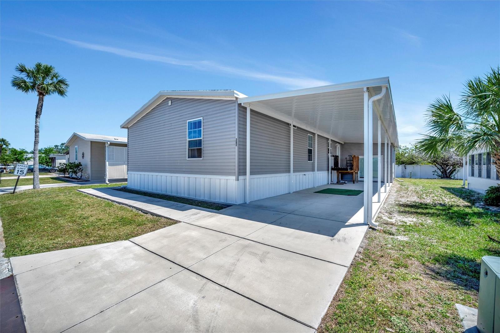 Welcome to Caribbean Isles Residential Cooperative. This home is a large 3 bedroom, 2 bath home split plan. Large eat-in Kitchen with the Laundry just off the Kitchen in a separate room. A large Pantry hidden in the Kitchen. The Primary Bedroom has a large Walk-in Closet with an Ensuite that contains a Professionally installed WALK-IN TUB. The home is low maintenance and well-maintained. Caribbean Isles Residential Cooperative is a highly desired community to live in. It is a VERY Active 55+ community. From Shuffleboard and Bocce Ball to Corn Hole and Horseshoes. We welcome Golf Carts and several times a year we gather and decorate for Parades. The Clubhouse is used for Dances, Games, Dinners and more. In the Clubhouse we have a well-stocked Library and a large Craft Room. The Game Room has 3 Billiard Tables, 2 Poker Tables, a Bar Shuffleboard with 2 Dart Boards. Don't miss this opportunity.