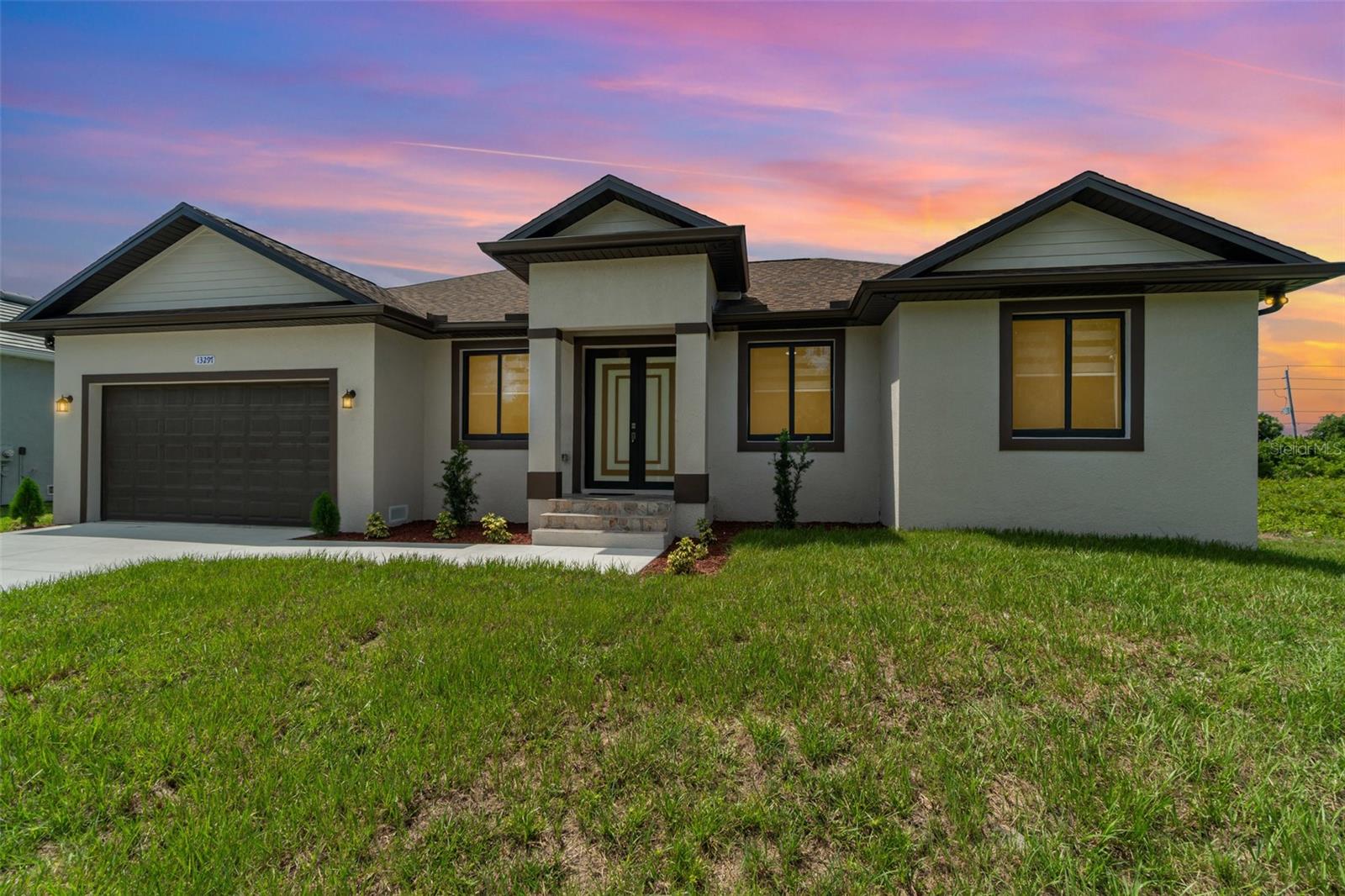 New construction in South Gulf Cove with clean, modern lines and seamless indoor-outdoor living. Single-story 3BR + office / 2BA / 2-car garage. Open concept with large-format porcelain tile throughout, striking frosted-glass double entry, slat accent wall and designer lighting. Show-stopping kitchen features an XL waterfall quartz island, shaker cabinetry, mosaic backsplash, stainless appliances and fixtures. Owner’s suite has dual vanities, frameless glass shower and a freestanding soaking tub. Bright secondary bedrooms with modern fans and zebra shades. Generous laundry room with sink and cabinets. Relax on the covered lanai with wet bar overlooking the backyard, perfect for grilling and entertaining. Minutes to Gasparilla Rd/FL-776, marinas, beaches and golf. Move-in ready and easy to show.