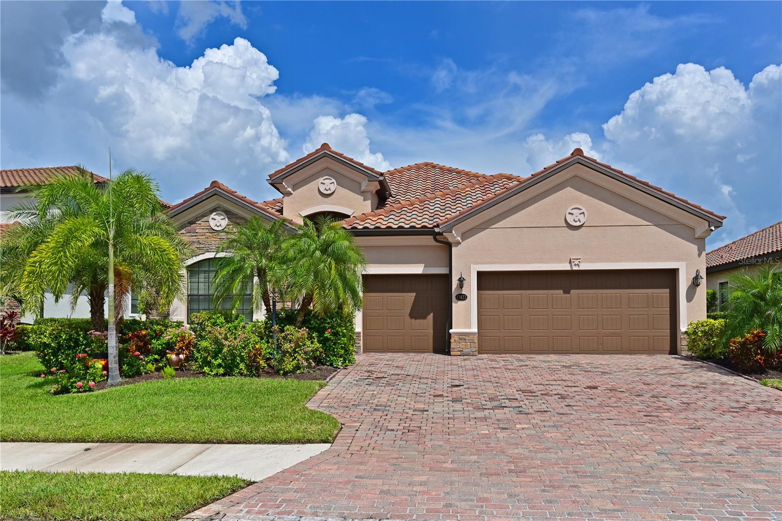 Discover luxury living in the picturesque, gated community of Bridgewater in Lakewood Ranch, Florida. This meticulously maintained home blends comfort, style, and the best of the Florida lifestyle.
As you arrive, you’ll be greeted by lush landscaping, a 3-car garage, and an elegant brick paver driveway and walkway. Step inside and you’ll find an inviting open layout featuring 10’ ceilings, tray ceilings, and crown molding throughout, setting the tone for timeless elegance.
The gourmet kitchen is the heart of the home, complete with granite countertops, GE stainless steel appliances including a gas stove, solid wood cabinetry, and a spacious pantry. An eat-in breakfast area flows seamlessly into the living space, making it ideal for both everyday living and entertaining.
From the living area, large sliding doors open onto a spacious screened lanai with serene water views—the perfect backdrop for morning coffee or evening gatherings.
This split floor plan offers privacy and functionality. The primary suite is a true retreat with tray ceilings, crown molding, a massive walk-in closet, and a spa-like bathroom featuring dual vanities, a soaking tub, and a walk-in shower. Three additional bedrooms provide comfort for family or guests. The outside security camaras will stay with the property.
Living in Bridgewater means enjoying maintenance-free landscaping in a community celebrated for its curb appeal and welcoming atmosphere. Residents enjoy parks, playgrounds, walking trails, and lakes, plus a vibrant social scene with clubs, outings, and events planned year-round.
All of this is located in top-rated Lakewood Ranch school districts, just minutes from UTC Mall, outlet shopping, fine dining, championship golf courses, and some of the world’s best beaches.
This home is a must-see—schedule your private showing today!