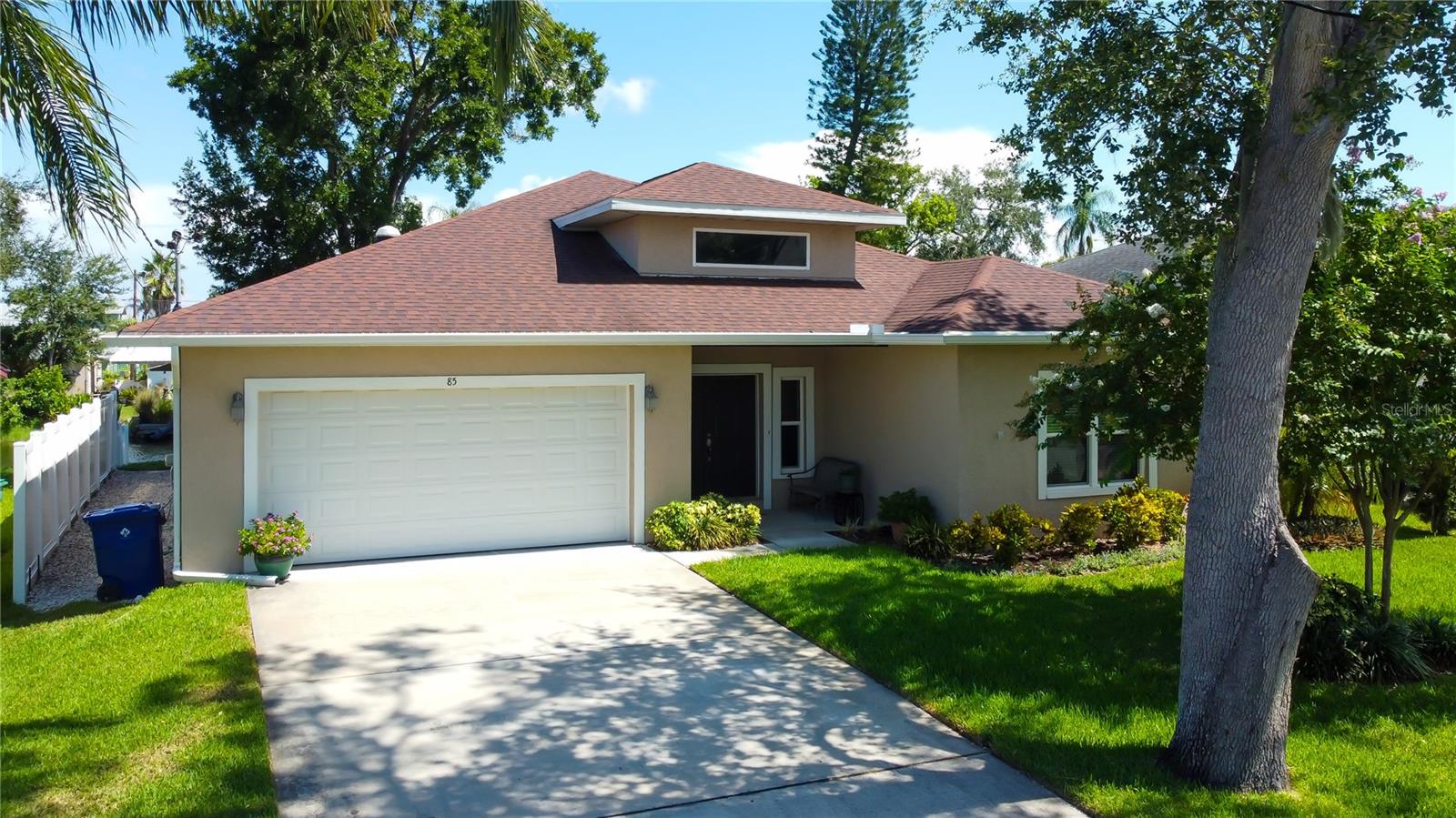 Here is your chance to purchase a beautiful 3 bed, 2.5 bath 2 car garage home on a canal with access to Lake Tarpon and the marina. 2065 sq ft of waterfront home in unincorporated Pinellas County, this home features a large double door entryway that opens up to a large open floorplan. The floors are newer luxury vinyl along with ceramic tile and carpet in the smaller bedrooms. The garage and main bathroom have solar light tubes. Walk in closet in the main bedroom. French doors from the main bedroom, living and dining give access to the deck and dock overlooking the canal. Property is 7 FT above sea level. Seller states that there have been no flooding issues from hurricanes. Plenty of room for your boat and water toys. Impact windows and doors, granite countertops and a large island with all appliances included. Inside laundry room with washer and dryer included. Easy access to US19, Innisbrook Golf Resort, several county parks, shopping, restaurants and Tarpon Springs. HOA is optional and the fee is $30.00 annually.