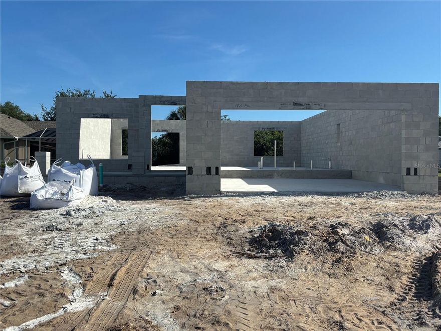 Under Construction. Under Construction. Spacious 5-bedroom, 3.5-bath home with a versatile loft and additional storage, designed for comfortable family living. This property offers excellent curb appeal with a welcoming front porch—perfect for relaxing or greeting neighbors. The open-concept floor plan provides an expansive living and dining area ideal for entertaining. The primary suite is conveniently located on the first floor, along with a guest powder room.  Upstairs features an oversized 17' x 19' loft, perfect for a media room, game room, or study space, along with four additional bedrooms, two full bathrooms, a laundry room, and a large storage closet.  Built by Adams Homes, this property includes a 1/2/10 builder warranty, in-wall pest control system, irrigation system, hurricane shutters, energy-efficient double-pane low-E windows, and a 50-gallon water heater. Interior finishes include granite countertops in the kitchen and bathrooms, ceramic wood-look plank tile flooring in main living and wet areas (no vinyl), 5¼-inch baseboards, bronze fixtures and hardware, LED recessed lighting, and a wired smoke detection system.  Located in the desirable Deep Creek community, residents enjoy convenient access to I-75, a public golf course with optional memberships, tennis courts, basketball court, playground, and nearby shopping and dining. The community offers city water and sewer, scenic greenbelts, no CDD fees, and a low annual HOA fee.