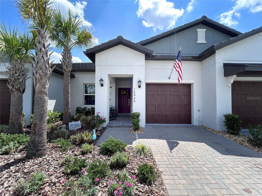 Welcome to easy Florida living in this beautifully upgraded single-story home located in the desirable Angeline Active Adult 55+ Community. This thoughtfully designed layout features two bedrooms, including a private owner’s suite with a walk-in closet and en suite bath.

The open-concept living space is perfect for entertaining, highlighting a stylish kitchen with a stunning glass tile backsplash, accented island, and upgraded lighting, all flowing seamlessly into the dining and family room.

Enjoy indoor-outdoor living with glass sliders leading to a screened lanai (new screen 2024) with ceiling fan, plus an additional grilling patio—perfect for relaxing or hosting guests. Additional upgrades include fresh interior paint throughout, rear gutters, pull-down attic stairs, and attic flooring for ample storage.

It is just an 8-minute walk to the resort-style clubhouse and pool, and conveniently located near the Veterans Expressway, shopping, dining, medical facilities, and more.