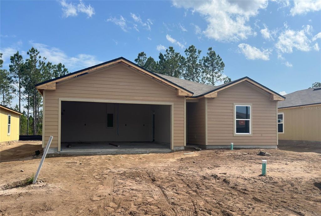 Photo of 74 Hulett Woods Road, Palm Coast, FL 32137 (MLS # FC300202)