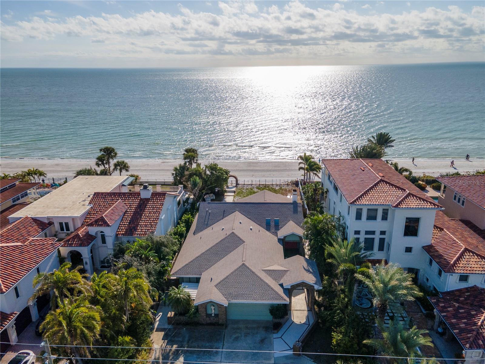 Positioned in the heart of Redington Beach's ELITE RESIDENTIAL ROW, 16110 Gulf Blvd stands as a prime investment amidst a landscape of distinguished beachfront homes and compounds. This is a once in a generation opportunity to get an "old Florida" beach house or build your dream oceanfront home.
Unlike neighboring Beach Towns where coastline views are often compromised by towering condo complexes obscuring coastal views, this property offers unparalleled, unobstructed vistas of the pristine Florida shoreline. With 65 feet of well-maintained gulf frontage and ideal setback, the lot is primed for the construction of a large contemporary luxury residence, tailored to meet the discerning tastes of its future owner.
The existing structure, renovated in the 1980s, is completely habitable and ensures immediate utility and comfort, serving as a functional living space. The home features vaulted ceilings, open floor plan, and great room and kitchen facing the water.
Renderings have been provided by John Cannon to depict a home that could be built on the property.
Prospective residents will enjoy direct access to Redington Beach's renowned white sands and crystal-clear Gulf waters. Additionally, the strategic location of 16110 Gulf Blvd provides convenient proximity to St. Petersburg, downtown Tampa, Amalie Arena (TB Lightning), Tropicana Field (TB Rays), Raymond James Stadium (TB Bucs), George Steinbrenner Stadium and various arts and cultural exhibits along the Gulf Coast. In addition, the home is just minutes to restaurants, world class golf courses, and shopping. Area beaches and bays are world renowned for boating, fising, and other water activities.
This property represents an exceptional opportunity for those seeking a distinguished coastal lifestyle with the added benefit of easy access to the vibrant entertainment and cultural offerings in the surrounding areas.