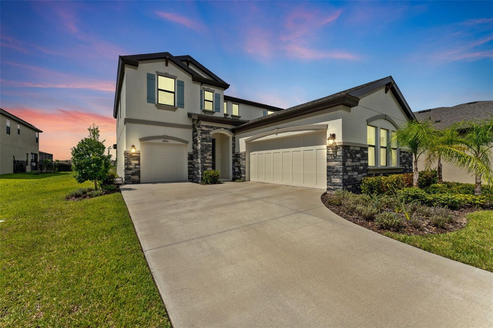 Welcome to this beautifully upgraded Ballast Point floor plan, located on a quiet cul-de-sac in the highly sought-after Hawkstone community. Built in 2023 and meticulously maintained, this home sits on an oversized lot—ready for your dream pool—and is completely move-in ready with fresh paint touch-ups and a recent March 2024 inspection already completed for your peace of mind.
Designed with the Coastal Design Collection, the interior features a gourmet chef’s kitchen with quartz countertops, premium cabinetry, a HUGE walk-in pantry, butler’s pantry, and stunning Executive Oak luxury vinyl plank flooring throughout the main living areas. The open-concept kitchen and café overlook the water and flow seamlessly into the spacious grand room and covered, screened lanai, perfect for entertaining.
The show-stopping formal foyer and staircase add timeless charm, while the main level also includes a private guest suite, pocket office ideal for homework or hobbies, and a flexible formal dining room that could be converted into a den or home office.
Upstairs, the private owner’s retreat includes a spa-like bathroom and a massive walk-in closet. Two additional bedrooms, a bonus loft, and an upstairs laundry room complete the second floor.
Located in the heart of Lithia, Hawkstone is a master-planned community offering resort-style amenities, beautiful natural surroundings, and easy access to US-301, I-75, and the scenic Triple Creek Nature Preserve with miles of pet-friendly hiking trails.
This is your chance to own a nearly-new home without the wait—schedule your showing today!