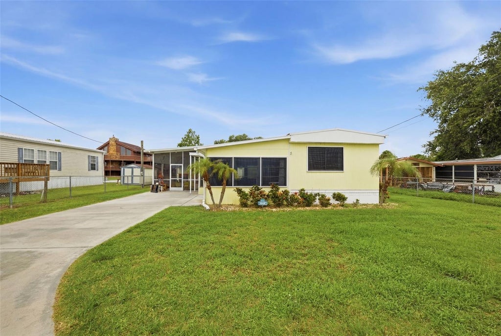 Photo of 1056 Blue Heron Lane, Moore Haven, FL 33471 (MLS # A4695914)