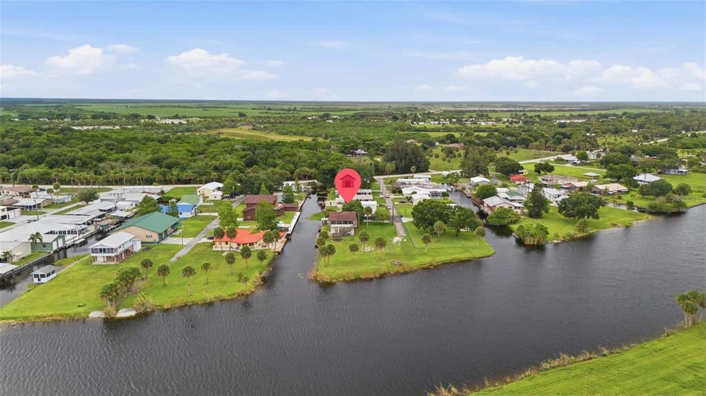Photo of 1056 Blue Heron Lane, Moore Haven, FL 33471 (MLS # A4695914)