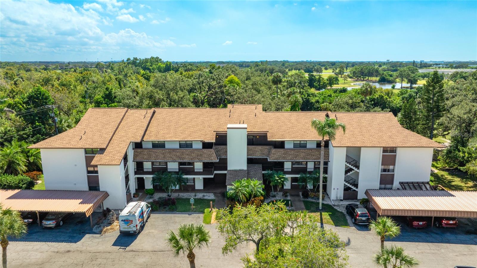 Discover this bright third-floor studio-style condo located in the 55+ community of Timber Creek Condominiums. Take the building elevator to step inside and find vaulted ceilings, a Murphy bed for flexible living space, in-unit laundry, a modern kitchen with breakfast bar, and a screened sunroom perfect for enjoying the peaceful views. Timber Creek offers a vibrant lifestyle with a par-3 golf course, clubhouse, pool, tennis and shuffleboard courts, sauna, and plenty of space to relax or socialize. Residents enjoy a friendly atmosphere and beautifully maintained grounds surrounded by mature Florida landscaping. This community is ideally located near the Gulf beaches, IMG Academy, shopping, dining, and everyday conveniences. Whether you’re looking for a seasonal getaway or a comfortable year-round home, this studio condo offers the perfect blend of relaxation, recreation, and location.