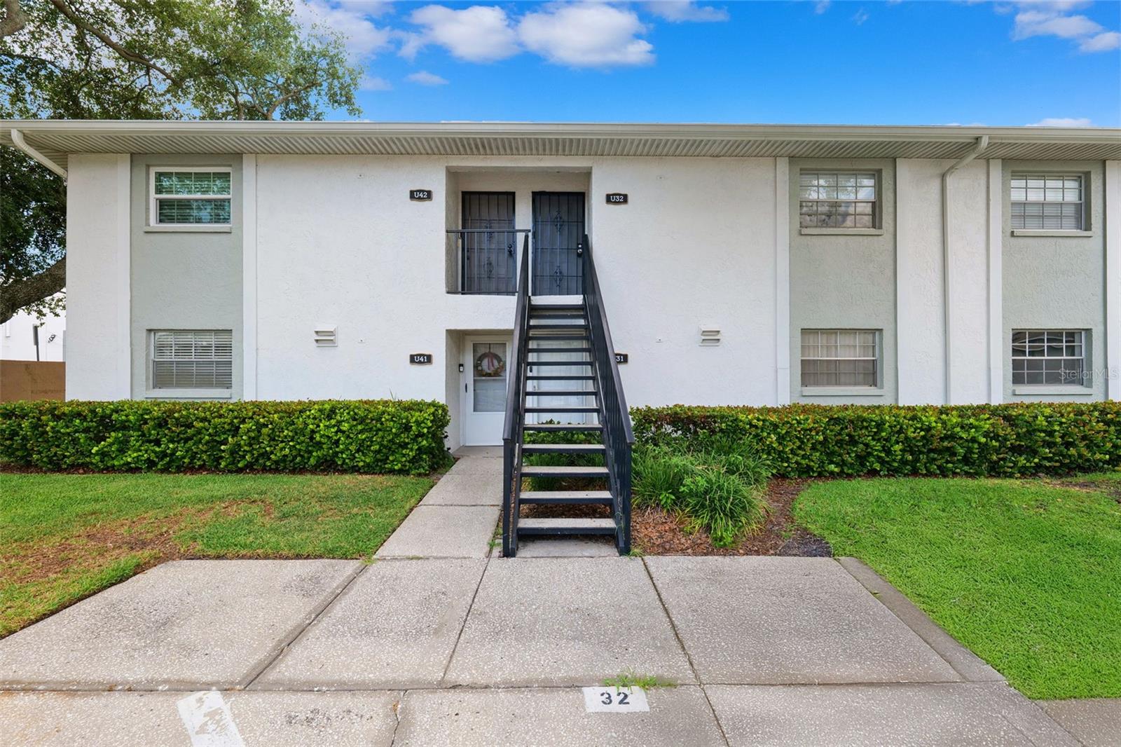 One or more photo(s) has been virtually staged. Move-In Ready 2-Bedroom Condo In Fair Oaks Condominium – Desirable South Tampa! This Charming First-Floor Condo Offers 2 Bedrooms And 1 Full Bathroom, Perfectly Designed For Comfort And Convenience. Beautiful Laminate Flooring Flows Seamlessly Throughout The Entire Home. The Kitchen Features Wood Cabinetry, Granite Countertops, And A Functional Layout That Connects Effortlessly To The Dining Area—Perfect For Everyday Living And Entertaining. Both Spacious Bedrooms Include Large Walk-In Closets, Providing Exceptional Storage. The Updated Bathroom Showcases A Modern Step-In Shower, Comfort Height Commode, and Large Storage Mirrored Medicine Cabinet.. The Screened-In, Enclosed Patio Includes A Storage Closet With Washer And Dryer Included, Making Everyday Living Even More Convenient.
Residents Of Fair Oaks Condominium Enjoy A Gated Pool, Fishing Pond With Pier, Clubhouse, And RV Lot (Available For An Additional Fee). With An Assigned Parking Space Just Outside Your Door, Ample Guest Parking, And An HOA That Covers Water, Sewer, Trash, Pest Control, Basic Cable, And Roof Maintenance, This Home Offers Worry-Free Living. Conveniently Located Near The Crosstown Expressway, Gandy Bridge, MacDill AFB, And Bayshore Blvd, You’ll Have Easy Access To Tampa’s Best Dining, Shopping, And Entertainment. Affordable, Low-Maintenance Living In One Of South Tampa’s Most Desirable Communities—Schedule Your Private Showing Today!