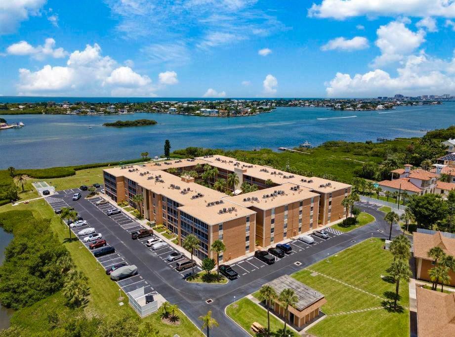 Welcome to New Atlantis Club a Waterfront & Gated Community!!! This gorgeous condo is a Two-bedrooms and Two-bathrooms fully furnished and everything included, with white beveled kitchen cabinets, island, stainless steel appliances, full size stackable washer & dryer, high ceiling, recessed and pendant lighting, very large dining and living area with a split floorplan, master bedroom has a queen size bed, and master bathroom has stand up shower. 2nd bedroom has a full-size bed and 2nd bathroom has stand up shower, luxury vinyl planks waterproof floors throughout and located on the 2nd floor with covered screen-in balcony. Rent Includes: All furniture, housewares, Cable TV, Electricity, Internet, Water, Sewer, Trash and 1 assigned parking spot and visitor parking. No pets allowed. Enjoy feeling like you're staying at a resort at New Atlantis Club on the Intracoastal Waterway with Amenities include 2 laundry facility, 2 heated pools, spa, clubhouse with kitchen, pool tables, library, business Center and fitness center, Tiki huts, BBQ grills and picnic tables, shuffleboard & tennis courts, canoe/kayak/bicycles storage and car wash area, and this community features direct access to John R Bonner Nature Park with hiking trails and a boardwalk. Located minutes from Beaches, shopping, hospitals, golf courses, restaurants and much more.