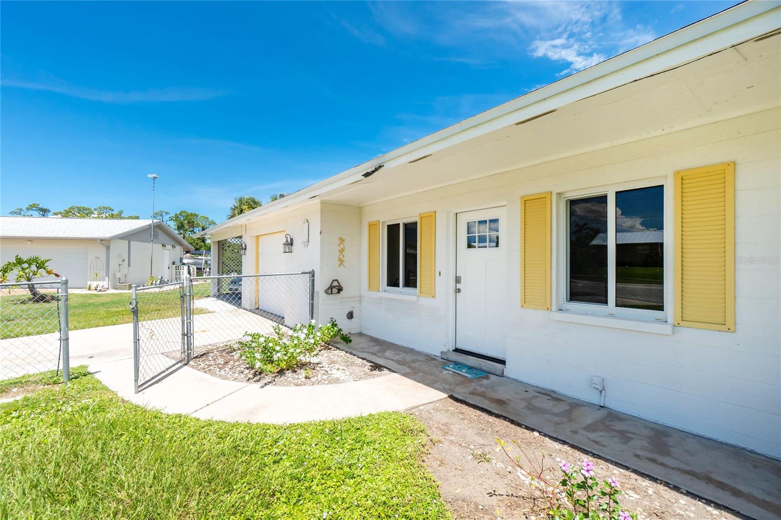 This 2-bedroom, 2-bath waterfront home offers over 200 feet of frontage on scenic Gottfried Creek, providing direct access to Lemon Bay and the Gulf of Mexico. While the home does require some TLC, it presents a fantastic opportunity to create your dream waterfront retreat.
The property includes an additional attached lot, offering privacy, expansion potential, or the option to build. Enjoy fishing from your private dock or watching spectacular sunsets from the spacious 10x19 lanai, which features western and northern views due to the cul-de-sac location. The lanai screening was removed after recent hurricanes but can be replaced.
Mature landscaping and large shade trees create a tranquil, shaded setting. With extensive waterfrontage, the possibilities for this property are endless. This property qualifies for an optional membership to the exclusive Englewood Gardens Beach Club is available. Membership provides access to a private beach with restrooms, a clubhouse for private events, gas grills, picnic tables, a gazebo, and Wi-Fi. Located just minutes from town, the home is approximately a 3-mile bike ride to Englewood Beach. Nearby Dearborn Street offers shopping, dining, and seasonal attractions, including a popular Thursday Farmers Market and a monthly classic car show on the first Saturday.