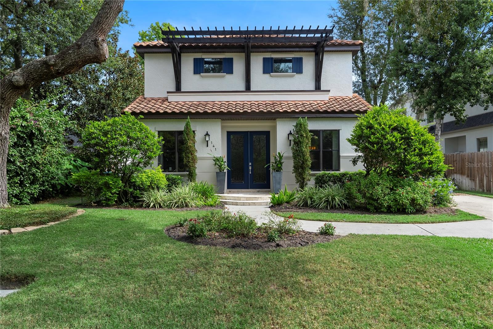 Welcome to 141 Oakwood Way, a one-of-a-kind custom-built estate in the highly desirable south Winter Park/Lake Sue area. This modern Mediterranean-inspired residence seamlessly blends timeless elegance with contemporary luxury, offering an exceptional living experience with high-end finishes, thoughtfully designed spaces, and unmatched attention to detail.
Step inside to whitewashed oak wood and travertine flooring, setting the tone for a warm and sophisticated ambiance. The open floor plan begins with a private front office, ideal for remote work, and a guest suite with a full bath—perfect for visitors or multi-generational living. The first-floor primary suite serves as a private retreat, featuring direct access to the patio for a peaceful outdoor escape. The spa-like en-suite bathroom boasts dual vanities, a walk-in shower, and a freestanding soaking tub, while the custom-built walk-in closet offers elegant storage solutions. Thoughtful details, like built-in wiring for a wall-mounted TV, enhance both convenience and luxury.
At the heart of the home is the gourmet kitchen, designed to impress with a solid walnut breakfast bar, quartzite, Carrara, and travertine countertops, Grohe faucets, and custom pullout/swivel cabinetry. A hidden pantry blends seamlessly into the custom cabinetry, while top-tier Thermador gas appliances, including a 42” refrigerator, make cooking a breeze. Flowing effortlessly into the family room and private courtyard, this space is perfect for entertaining.
Upstairs, you'll find stunning Venetian plaster walls and a modern glass stair railing leading to a versatile loft space. Three additional bedrooms are located on this level, each featuring custom-built walk-in closets for optimal organization. One of the upstairs bedrooms includes a private en-suite, while the bonus loft opens to a covered balcony through elegant French doors, providing a tranquil indoor-outdoor retreat. Plush new carpeting in the bedrooms enhances the comfort and style of the upper level.
Designed for seamless outdoor living, this home features a custom-built gas fire pit, summer kitchen, and outdoor grill, making it perfect for year-round entertaining. The expansive upstairs balcony offers additional entertainment space, large enough for a ping pong table, outdoor lounge, or media area.
A two-car rear side-entry garage, connected to the main house by a charming esplanade walkway, offers both privacy and convenience while enhancing the home’s architectural beauty. The freshly painted exterior adds to the home’s pristine appeal, making it truly move-in ready.
Located within one of Winter Park’s most desired school districts, this home is zoned for Audubon K-8 and Winter Park High School. Plus, you’re just minutes from East End Market and Park Avenue, with the area's finest dining, shopping, and cultural attractions.
This is more than a home—it’s an expression of refined living and timeless design. Schedule your private tour today!