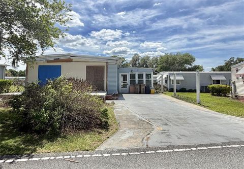 Photo of 145 Royal Palm Drive, Leesburg, FL 34748 (MLS # G5111034)
