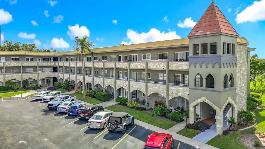 Clearwater - On Top of The World - This 1100 sq ft 2 bedroom, 2 bath second-floor center unit is conveniently located near the East Community Center at the end of a quiet street near the Duke Energy Trail. Florida living at its finest! Enter to the spacious and open living room/dining room combo with luxury vinyl flooring, neutral colors, and plenty of natural light. The kitchen is light and bright with white cabinets, white appliances, and tile flooring. The Florida room has a wall of windows to let in the natural light. The master bedroom has an x-large triple closet, luxury vinyl flooring, and a private bathroom complete with a vanity and a walk-in shower. The window can be replaced with French Doors to allow easy access to the family room. The second bedroom has a large closet and luxury vinyl flooring, with the guest bath right down the hall. Updates include windows and fresh paint. Assigned parking space in front of the building. This 55+ community has two activity centers and two private golf courses with 9 and 18 holes, free exclusively for resident owners. The HOA also covers free internet and cable TV with Summit. There are two swimming pools; one is heated. The remodeled Cardio Gym has the latest exercise equipment. A very pet-friendly community, there is a fenced dog park with covered seating. There are hobby studios and a woodshop for the exclusive use of the residents. Activities include fitness classes, dancing, clubs, cards, billiards, entertainment, classes, and much more. The on-site Good Karma Café has snacks and take-n-bake meals. The OTOTW community has free bus service as well as additional transportation options available, including wheelchair service. A variety of medical resources are located nearby. Close to shopping, restaurants, and entertainment. Make your appointment today!