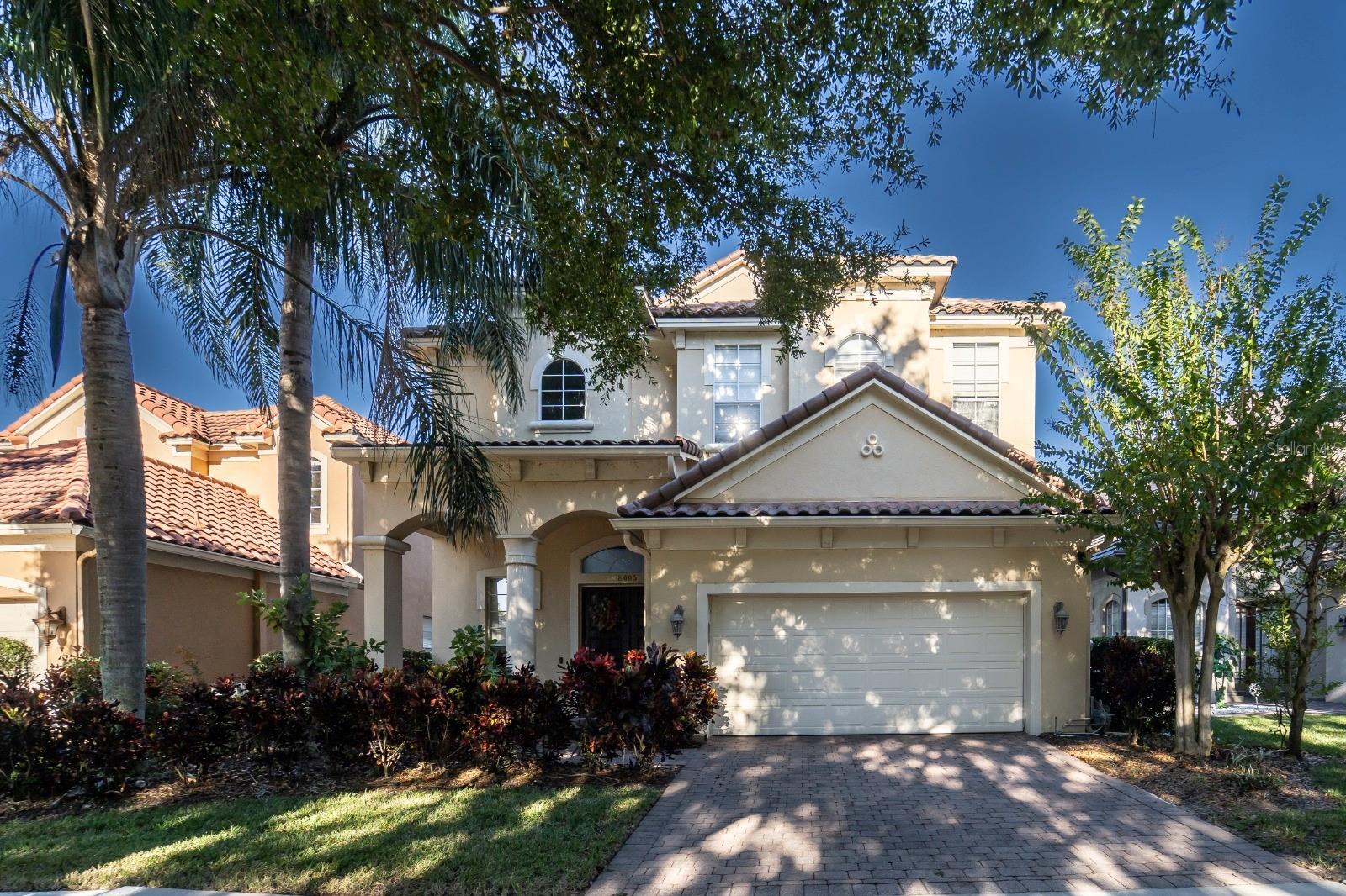 Discover luxury living in this furnished three-story lakefront estate, ideally situated in the highly sought-after 24-hour guard-gated community of Vizcaya in Dr. Phillips. Perfectly positioned, the home offers breathtaking views of Orlando’s skyline, including nightly vistas of The Wheel at Icon Park, and sits just steps away from renowned “Restaurant Row,” home to the finest dining in town. With quick access to major highways, you’re only 15 minutes from world-class attractions such as Disney, Universal, and downtown Orlando. It truly doesn’t get more convenient than this.
This impressive 5,160 sq. ft. residence boasts panoramic lake views from the family room, kitchen, master suite, and all three balconies. Featuring 5 spacious bedrooms and 5 bathrooms, the home blends elegance with functionality, offering a private pool and spa with a gourmet outdoor area for entertaining.
The main level showcases an open great room and dining area, a luxurious master suite, a family room, a chef’s kitchen, and a dedicated office. On the third level, you’ll find three bedrooms, two full bathrooms, and a versatile loft space. The lower level is a retreat of its own, featuring an en-suite bedroom with direct pool access—ideal for guests or in-laws—alongside a vast entertainment area, an additional full bathroom, a media room ready for your custom theater build-out, and one of the largest private home gyms in the area.
Beyond the home itself, Vizcaya offers resort-style amenities, including tennis courts, a clubhouse, a fitness center, and a playground, all within the safety of a 24-hour guard-gated community.
This is more than a home—it’s a lifestyle.
