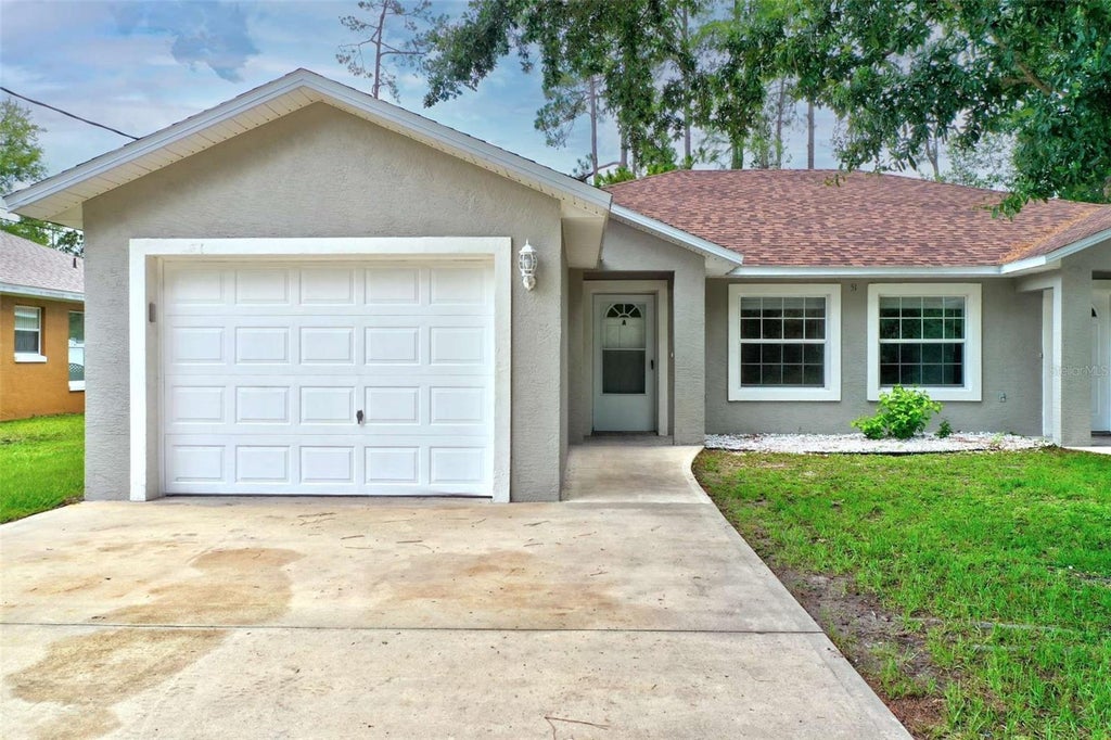 Photo of 51 Wellwood Lane #A, Palm Coast, FL 32164 (MLS # FC321225)