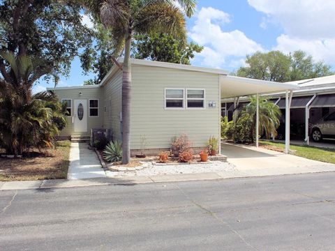 Photo of 47 Thatch Palm Street W, Largo, FL 33770 (MLS # TB8494459)