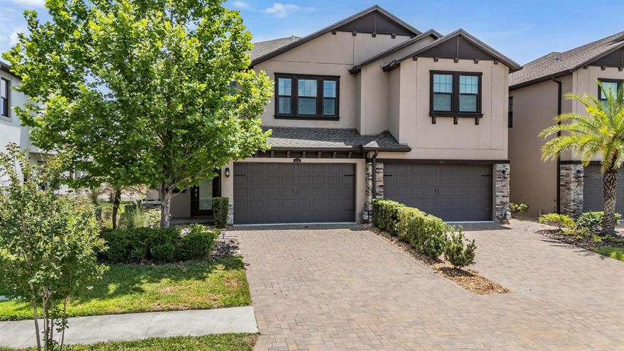 Set within the master-planned community of Estancia, this end-unit townhome offers a blend of low-maintenance living and elevated design in one of Wesley Chapel’s most desirable neighborhoods. Tucked along a quiet street that leads to a cul-de-sac, the home spans over 2,000 square feet and lives larger than expected, with thoughtful spaces that balance everyday comfort and effortless entertaining.

From the moment you step inside, the wood-look tile flooring carries throughout the main level, setting a warm, cohesive tone. The kitchen is both functional and refined, featuring quartz countertops, 42-inch cabinetry with crown molding, soft-close drawers, a stylish backsplash, and stainless steel appliances anchored by a gas range. The oversized island opens seamlessly to the living area, creating a natural gathering space, while sliding glass doors draw your eye out to the screened lanai overlooking a peaceful pond backdrop. A versatile den on the first floor offers flexibility for a home office, playroom, or quiet retreat.

Upstairs, all three bedrooms are thoughtfully positioned along with a full bath and a well-equipped laundry room. The owner’s suite is a true escape, complete with a tray ceiling, a spacious walk-in closet with custom organization, and a private screened balcony that captures wide water views. The ensuite bath features dual vanities and a walk-in shower, creating a spa-like feel at home.

Additional details elevate the home’s appeal, including plantation shutters, motorized solar shades, 8-foot interior doors, recessed LED lighting, a tankless water heater, water softener, and a two-car garage with epoxy flooring and overhead storage. Even the brick-paver driveway adds to the home’s curb appeal.

Living in Estancia means access to a lifestyle that feels more like a resort, with a beautifully appointed clubhouse, fitness center, multiple pools, sports courts, playground, dog park, and scenic walking trails woven throughout the community. Here, you’re not just buying a home—you’re stepping into a lifestyle designed for both relaxation and connection.  IT'S NOT JUST A HOME...BUT A LIFESTYLE!