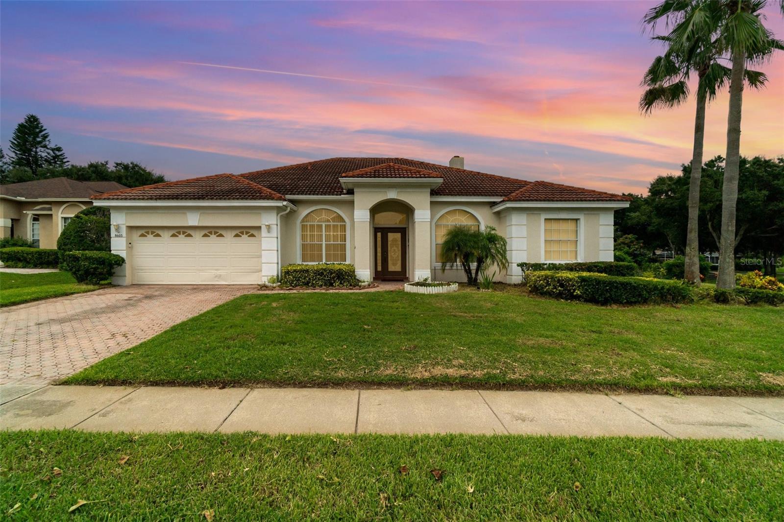 Discover this beautifully updated 4-bedroom, 3-bath residence in the sought-after Emerald Forest community of Dr. Phillips. Perfectly positioned on a corner lot, this home offers the elegance of a tile roof, soaring ceilings, and an inviting wood-burning fireplace that anchors the living space. This meticulously maintained residence has undergone extensive renovations, where nearly every detail has been elevated upgraded flooring and refined finishes combine to create a seamless balance of comfort and sophistication.
The heart of the home flows naturally outdoors to a stunning resort-style pool area, fully transformed with elegant travertine tile decking and a resurfaced pool under a screened lanai—an ideal setting for entertaining or quiet retreat. Mature landscaping enhances the property’s curb appeal while providing privacy and shade.
Emerald Forest residents enjoy community amenities including a pool, tennis courts, and dock access to Lake Crowell. With top-rated schools nearby and quick access to Restaurant Row, major highways, and Orlando’s attractions, this home delivers the best of Dr. Phillips living with a touch of luxury and timeless quality.