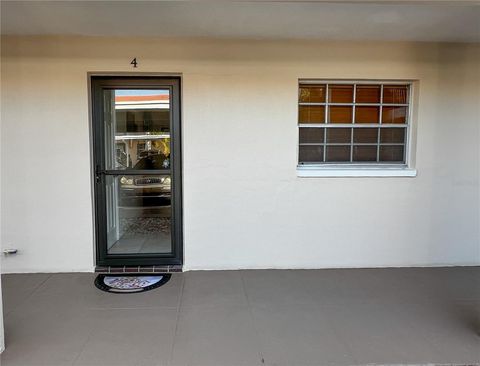 Photo of 10350 Imperial Point Drive W #4, Largo, FL 33774 (MLS # TB8429427)