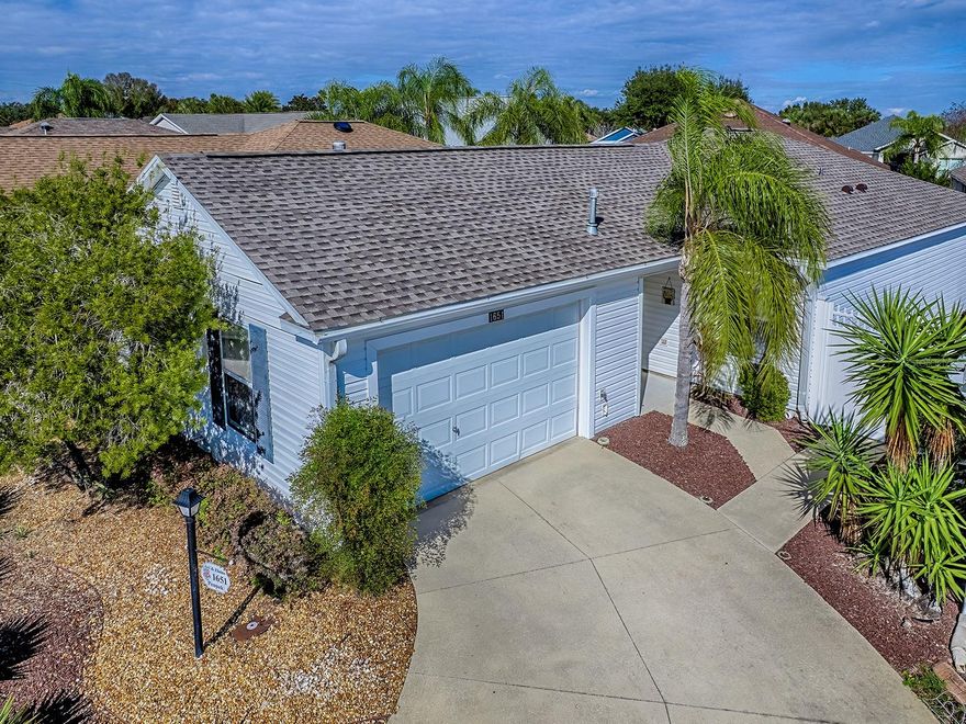 Living The Good Life In THE VILLAGES in this 2/2 Marathon Court Yard Villa.  Excellent Location in the Village of Poinciana.  Between Lake Sumter Landing and Brownwood Town Squares!  6 Pools within a half mile, Abundance of Golf, Pickle Ball, Shuffle Board, Bocce Ball and Cane Garden Country Club right here.  ROOF – 2025, Hot Water Heater – 2023, HVAC – 2005.  Property is being sold with a Lovely TURNKEY Package INCLUDOING A YAHAMA GOLF CART!  Beautiful Engineered Hardwood Floors through main living area.  VAULTED CEILINGS.  Guests will enjoy their privacy with bedroom and bathroom off to the side.  Master has large walk-in closet and step in shower.  Relax in the ENCLOSED LANAI!  Low to No Maintenance yard.  Stone hardscape with a small area of grass for the 4 legged family member.  Water softener and security system.  NOTICE There are No Homes In Front and a High Stone Wall In Back!  Can't get better that that.  You’ll love the home and location.  NO BOND!!  Come on over and see it.