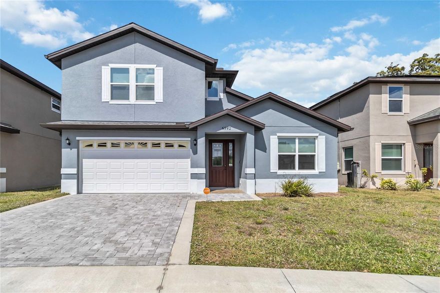 Located in a desirable neighborhood just minutes from Orlando International Airport, Lake Nona, and downtown Orlando, with easy access to Tampa via major highways, this 2022 home is a move-in ready gem. Schedule your private showing today!

This beautifully maintained and tastefully decorated home seamlessly blends modern elegance with classic charm. The main floor features three bedrooms and two bathrooms. A loft adds excitement to entertaining. An additional bedroom with an ensuite bathroom upstairs offers even more space. With its inviting design, this home is filled with warmth and natural light. The stylish kitchen boasts pristine cabinetry, stainless steel appliances, a range, modern countertops, and a custom kitchen with a walk-in closet. Modern flooring flows throughout, adding a touch of sophistication and warmth to the space. The spacious living room is perfect for relaxing or entertaining, with neutral colors that complement any decorating style. A generously sized covered patio provides a cozy relaxation space on a pleasant summer afternoon. The paved backyard requires no maintenance and offers ample space for growing herbs. The spacious master bathroom features modern finishes and a deep soaking tub. And much more! Don't miss this move-in ready gem—schedule your private showing today!