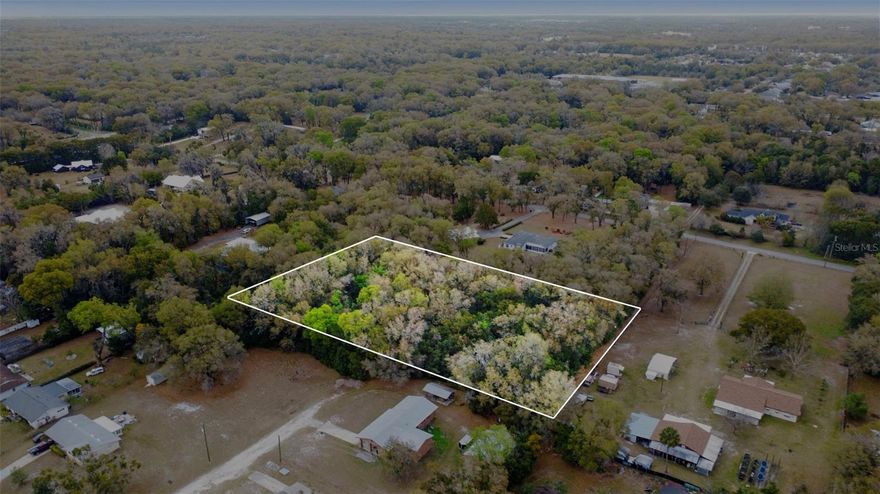 Discover the perfect blend of privacy and convenience with this beautiful 2.45-acre buildable lot tucked away in a peaceful setting. Whether you're dreaming of a custom estate, a modern farmhouse, or a quiet retreat surrounded by nature, this spacious parcel offers the ideal canvas.

Enjoy the added value of a deeded access easement already in place, making access simple and secure while maintaining the secluded feel buyers love.

Located just minutes from local schools, shopping, dining, and vibrant downtown DeLand, you’ll have everyday conveniences close by without sacrificing tranquility. 

If you're looking for space to spread out while staying connected to town, this hidden gem checks all the boxes.