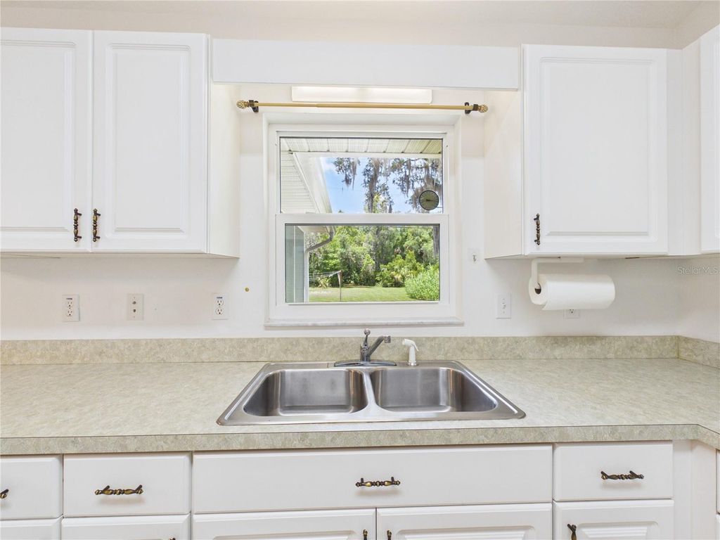 Photo of 11236 N Rain Point, Inglis, FL 34449 (MLS # OM727379)