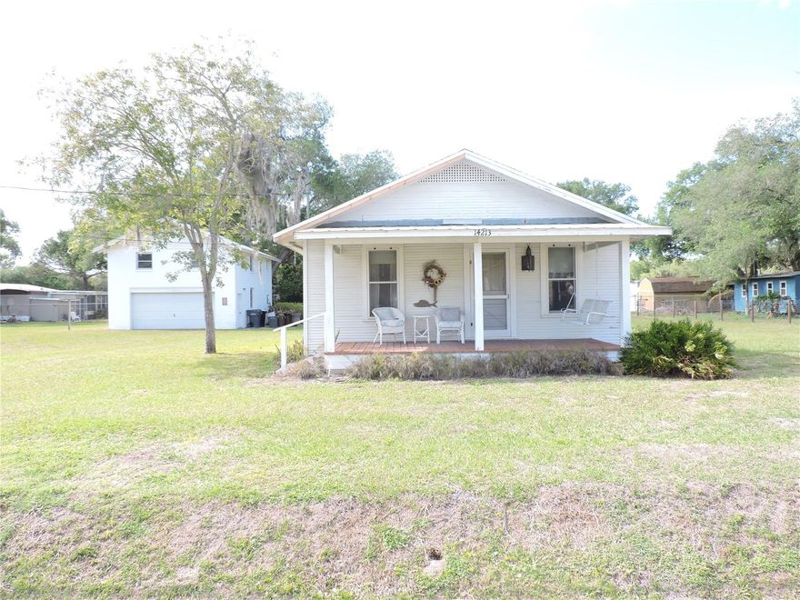 A QUAINT 2 BEDROOM 2 BATH FLORIDA CRACKER HOME THAT IS OVER 100 YEARS OLD. YOU NEED TO SEE THIS HOME TO APPRECIATE IT. THE HOME SITS ON 3 LOTS (140'x145' M/L). THERE IS A DETACHED TWO CAR GARAGE WITH AN EFFICIENCY APARTMENT ABOVE. THIS LISTING INCLUDES THREE DEEDED BOAT SLIPS TO THE CANAL LEADING TO THE KISSIMMEE RIVER AND BEYOND.