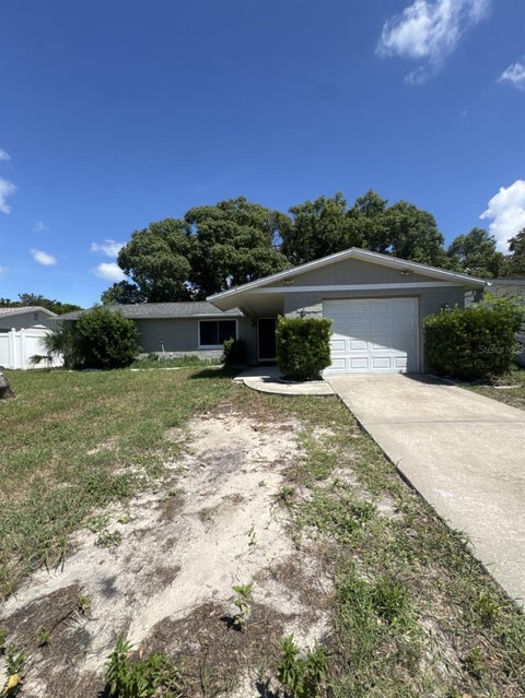 Photo of 8930 Windsong Lane, Port Richey, FL 34668 (MLS # O6438756)