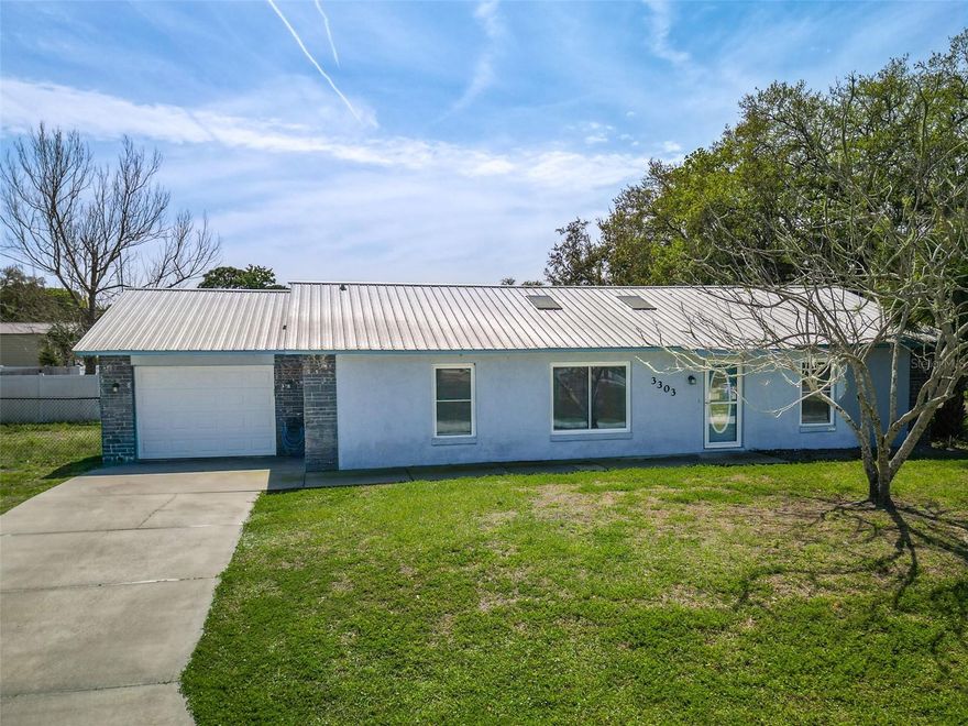 3-bedroom, 2-bath home featuring a desirable open floor plan and split-bedroom layout for added privacy. The updated kitchen boasts modern finishes, stainless steel appliances, and ample cabinet space, perfect for both everyday living and entertaining. Enjoy additional living space in the bright Florida room, ideal for relaxing or hosting guests.

This home also includes an inside laundry room for convenience, a 1-car garage with a separate storage room, and a durable metal roof for long-term peace of mind. The fully fenced yard offers privacy and plenty of space for outdoor activities, pets, or gardening.