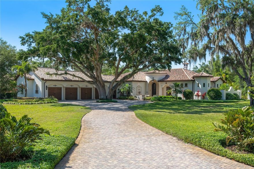 Stunning Mark Nasrallah designed residence, located in the prestigious gated enclave of Chaine Du Lac. Set on an expansive 1.29 Acre lot, this stunning home boasts 4,712 square feet of impeccably designed living space and an impressive 8,590 square feet under roof.  Step inside and you are immediately greeted with high ceilings, rich architectural details, and lots of windows that flood the home with natural light and offer seamless views of the gorgeous outdoor living spaces. Sophisticated finishes such as custom millwork, imported stone, and designer lighting elevate every room with a sense of understated opulence. The gourmet kitchen is a culinary masterpiece, complete with top-of-the-line appliances, custom cabinetry, a large center island, a hidden walk-in pantry and an adjoining breakfast nook. The expansive living and dining areas flow effortlessly to the outdoors, creating a perfect harmony of indoor-outdoor living.  The primary suite is a private retreat, featuring an elegant sitting area, a large walk-in closet, and a spa-inspired bath with an oversized soaking tub, a luxurious walk-in shower overlooking a private courtyard with a fountain, and exquisite designer finishes that elevate the experience of relaxation.  Step outside to your private backyard retreat, where tropical landscaping surrounds a resort-style pool and spa, offering complete seclusion and serenity. The expansive covered patio features a fully equipped summer kitchen, multiple seating areas, making it the perfect space for entertaining. Additional amenities include a sprawling four-car garage that provides ample room for the car enthusiast in the family, three more generously sized bedrooms with en-suite bathrooms, a dedicated home office, and a wine cellar. Located in the exclusive community of Chaine Du Lac this home is minutes from top-rated schools, championship golf courses, and the world-class dining and shopping. You are also just minutes away from all of the area atractions. This is more than a home it’s a statement of luxury, design, and unparalleled craftsmanship, don't miss the opportunity to make it yours.